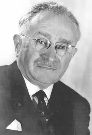 Schwarz-Weiß-Porträt von Ludwig Guttmann in Anzug und Krawatte, mit runder Brille